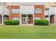 Brick patio with privacy fence and grill backing onto a manicured green lawn at 59 Townview Dr, Alpharetta, GA 30022