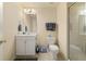 This is a full bathroom with a shower, toilet, vanity, storage, and neutral walls at 59 Townview Dr, Alpharetta, GA 30022