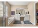 This is a relaxing bathroom with a soaking tub, and sinks, and access to the walk-in closet at 59 Townview Dr, Alpharetta, GA 30022