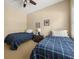 Bedroom featuring two beds, neutral walls, natural light, and a ceiling fan at 59 Townview Dr, Alpharetta, GA 30022