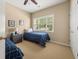 Bright bedroom with two twin beds, a window, and a nightstand with lamps at 59 Townview Dr, Alpharetta, GA 30022