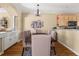 Cozy dining room area featuring neutral colors and contemporary chandelier at 59 Townview Dr, Alpharetta, GA 30022