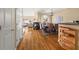 Open-concept dining and living area features hardwood floors, neutral paint, a fireplace, and a staircase at 59 Townview Dr, Alpharetta, GA 30022