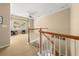 Hallway with staircase, light-colored walls, a desk, and a ceiling fan at 59 Townview Dr, Alpharetta, GA 30022