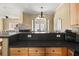 Open kitchen area showcasing a breakfast bar and a view to the adjacent living spaces at 59 Townview Dr, Alpharetta, GA 30022
