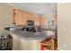 Functional kitchen with sleek countertops, light wood cabinets, and modern black appliances at 59 Townview Dr, Alpharetta, GA 30022