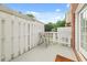 Outdoor patio with a white fence and a comfortable metal chair at 59 Townview Dr, Alpharetta, GA 30022