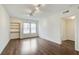 Bright bedroom with hardwood floors, modern lighting, built in shelving and large window at 199 14Th St # 409, Atlanta, GA 30309