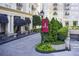 Elegant condominium exterior with manicured landscaping and covered entrance at 199 14Th St # 409, Atlanta, GA 30309