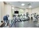 Bright gym with treadmills, elliptical machines, and mounted television at 199 14Th St # 409, Atlanta, GA 30309