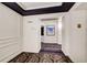 Hallway in building featuring patterned carpeting, crown molding, and recessed lighting at 199 14Th St # 409, Atlanta, GA 30309
