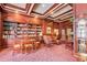 A library with comfortable seating areas and French doors at 199 14Th St # 409, Atlanta, GA 30309
