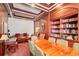 A spacious library area with dark wood paneling, a large table, and ample seating at 199 14Th St # 409, Atlanta, GA 30309