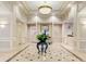 Grand lobby with marble floors, ornate columns, reception desk and beautiful floral arrangement at 199 14Th St # 409, Atlanta, GA 30309