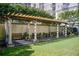 Outdoor patio area with pergola, seating, and barbecue grill at 199 14Th St # 409, Atlanta, GA 30309