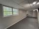 Finished basement with a window and drop ceiling at 2184 River Acres Ct, Lithonia, GA 30058