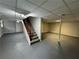 Spacious finished basement featuring stairs and lighting at 2184 River Acres Ct, Lithonia, GA 30058