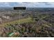 Expansive aerial view of the property, showcasing its location, wooded area and surrounding landscape at 3721 Mason Creek Rd, Winston, GA 30187
