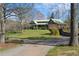 Log home with stone exterior and green metal roof at 3721 Mason Creek Rd, Winston, GA 30187