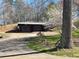 Detached two-car garage featuring rustic sliding doors at 3721 Mason Creek Rd, Winston, GA 30187