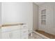 Modern bathroom shows tiled shower, recessed shower niche and vanity awaiting completion for a sleek design at 388 Londonberry Road, Sandy Springs, GA 30327
