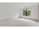 A serene and light filled bedroom boasts expansive windows, creating a blank canvas for inspired design at 388 Londonberry Road, Sandy Springs, GA 30327