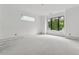 A light filled bedroom with large windows offers a serene space awaiting personalization and comfort at 388 Londonberry Road, Sandy Springs, GA 30327
