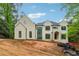 View of the house featuring a neutral color palette and eye-catching black-trim windows at 388 Londonberry Road, Sandy Springs, GA 30327