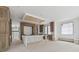 Large, unfinished kitchen boasting custom wood cabinets, a central island, fireplace, and window bench seating at 388 Londonberry Road, Sandy Springs, GA 30327