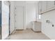 Laundry room featuring cabinets and a door leading to the outside at 388 Londonberry Road, Sandy Springs, GA 30327