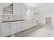 Laundry room under construction featuring shaker cabinets, sink and bright natural light at 388 Londonberry Road, Sandy Springs, GA 30327