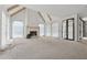 Bright living room showcasing high ceilings with wooden beams and a modern fireplace at 388 Londonberry Road, Sandy Springs, GA 30327