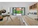 An under-construction room featuring black frame sliding glass doors to the backyard at 388 Londonberry Road, Sandy Springs, GA 30327