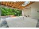 Covered patio under construction, featuring skylights, outdoor kitchen, and backyard views at 388 Londonberry Road, Sandy Springs, GA 30327