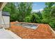 Unfinished outdoor pool with surrounding landscaping ready for customization at 388 Londonberry Road, Sandy Springs, GA 30327