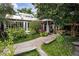 Restaurant exterior featuring a landscaped walkway and light filled dining room at 388 Londonberry Road, Sandy Springs, GA 30327