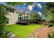 Backyard with manicured lawn and treelined perimeter giving a private relaxing feel at 3220 Millwood Se Trl, Smyrna, GA 30080