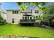 Home backyard with lush lawn, a patio, and plenty of space for outdoor activities at 3220 Millwood Se Trl, Smyrna, GA 30080