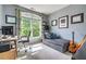 Versatile bedroom with a large window, desk, and seating area, perfect for a home office or guest room at 3220 Millwood Se Trl, Smyrna, GA 30080