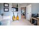 Cozy bedroom featuring guitars, a modern entertainment center, and a doorway leading to the primary bedroom at 3220 Millwood Se Trl, Smyrna, GA 30080