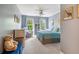 Inviting bedroom with a comfortable queen bed, soft natural light, and a cozy armchair near the window at 3220 Millwood Se Trl, Smyrna, GA 30080