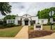 Charming white brick clubhouse with manicured landscaping and inviting entrance walkway at 3220 Millwood Se Trl, Smyrna, GA 30080