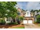 Charming two-story brick home with a well-manicured lawn and a two-car garage at 3220 Millwood Se Trl, Smyrna, GA 30080