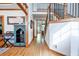 Inviting hallway with hardwood floors, decorative accents, and staircase leading to the upper level at 3220 Millwood Se Trl, Smyrna, GA 30080
