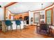 Kitchen and bright breakfast nook with hardwood floors, wood cabinets, stainless appliances, and backyard views at 3220 Millwood Se Trl, Smyrna, GA 30080