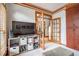 Stylish media room features a large TV and storage solutions for a streamlined look at 3220 Millwood Se Trl, Smyrna, GA 30080
