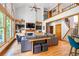 Open-concept living room with large windows, a fireplace, built-ins, and hardwood floors at 3220 Millwood Se Trl, Smyrna, GA 30080