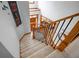 Inviting staircase with wooden railing and iron spindles leading to a bright, open entryway at 3220 Millwood Se Trl, Smyrna, GA 30080