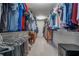 Spacious walk-in closet with ample storage and well-organized hanging racks and shelving at 3220 Millwood Se Trl, Smyrna, GA 30080