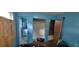 This bedroom features doors to a closet and bathroom, and light blue walls at 45 James P Brawley Nw Dr, Atlanta, GA 30314